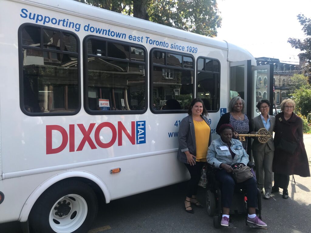 Dixon Hall, city of Toronto, and province of Ontario representatives are presented with the "key" to the new, accessible bus