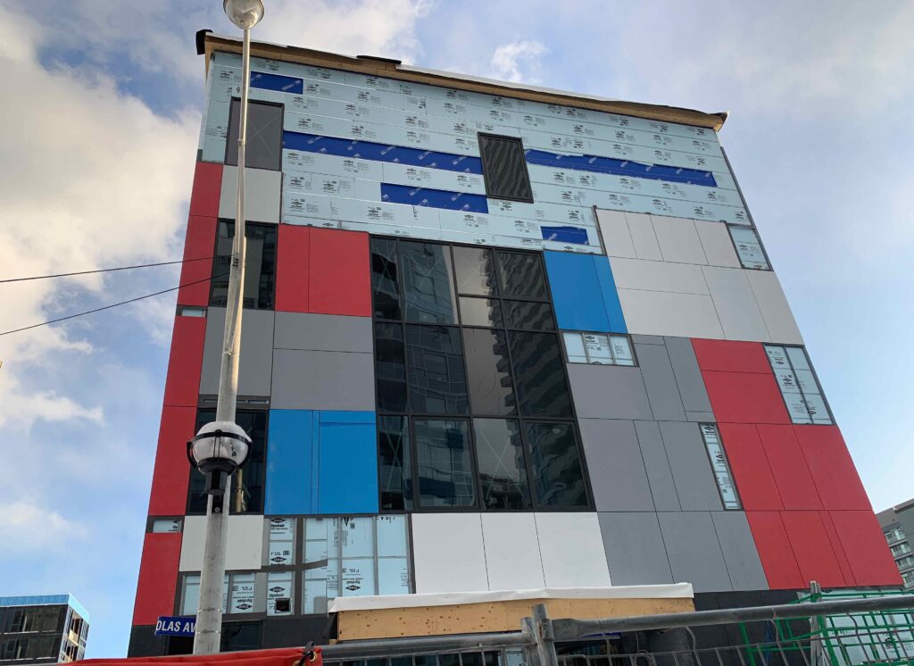 Youth Centre Construction Update: Exterior Cladding, Windows and Doors Complete!