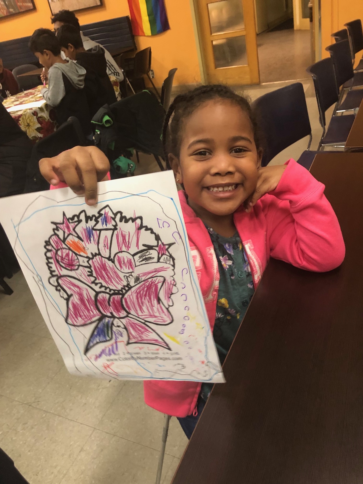 photo of girl at christmas party holding colouring book